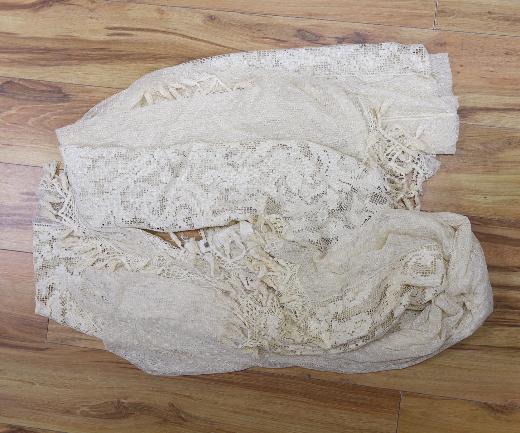 A pair of Edwardian fine net curtains bordered with wide fillet lace, edged with tasselled bobbin lace 272 x 155cm